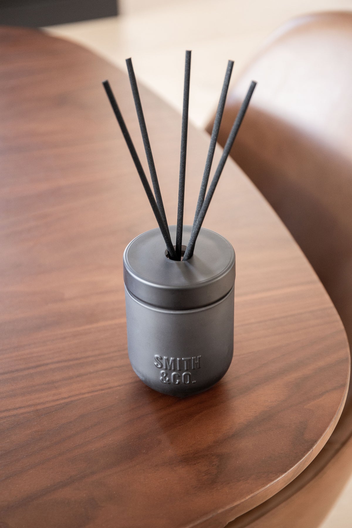 Angled close view of the Smith & Co. diffuser on a dark timber tabletop