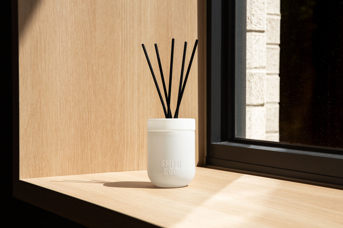Wide view of the white Smith and Co diffuser on a sunlit timber window ledge