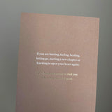 A brown notebook with the quote "This Was Meant To Find You (When You Needed It Most)" by Thought Catalog.
