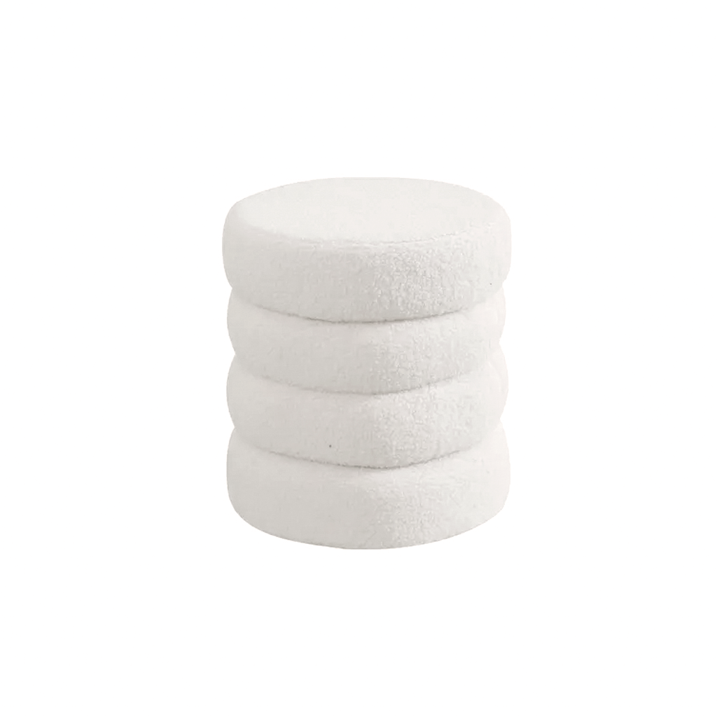 White tiered boucle ottoman, four stacked rounds forming a soft cylindrical seat