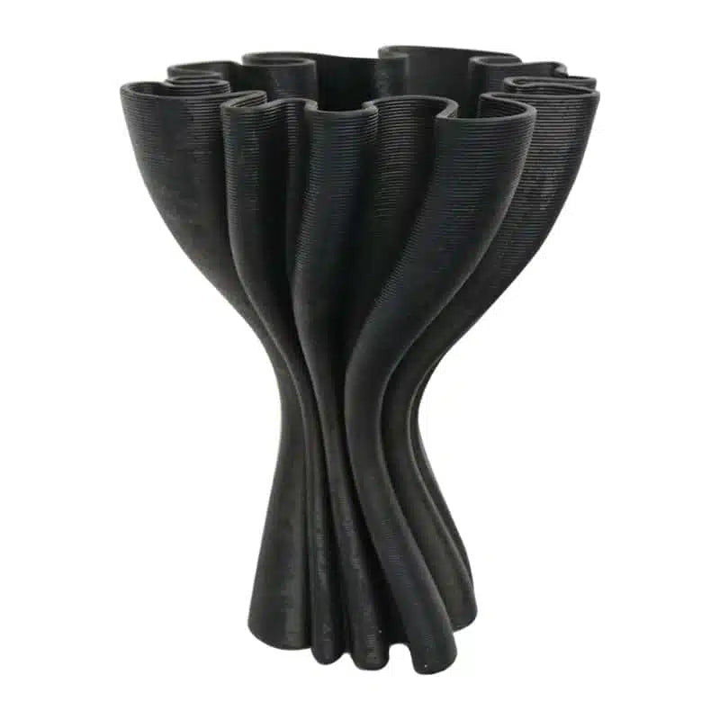 Black Cooper 3D printed porcelain vase on a plain background, showing the twisted ruffled form