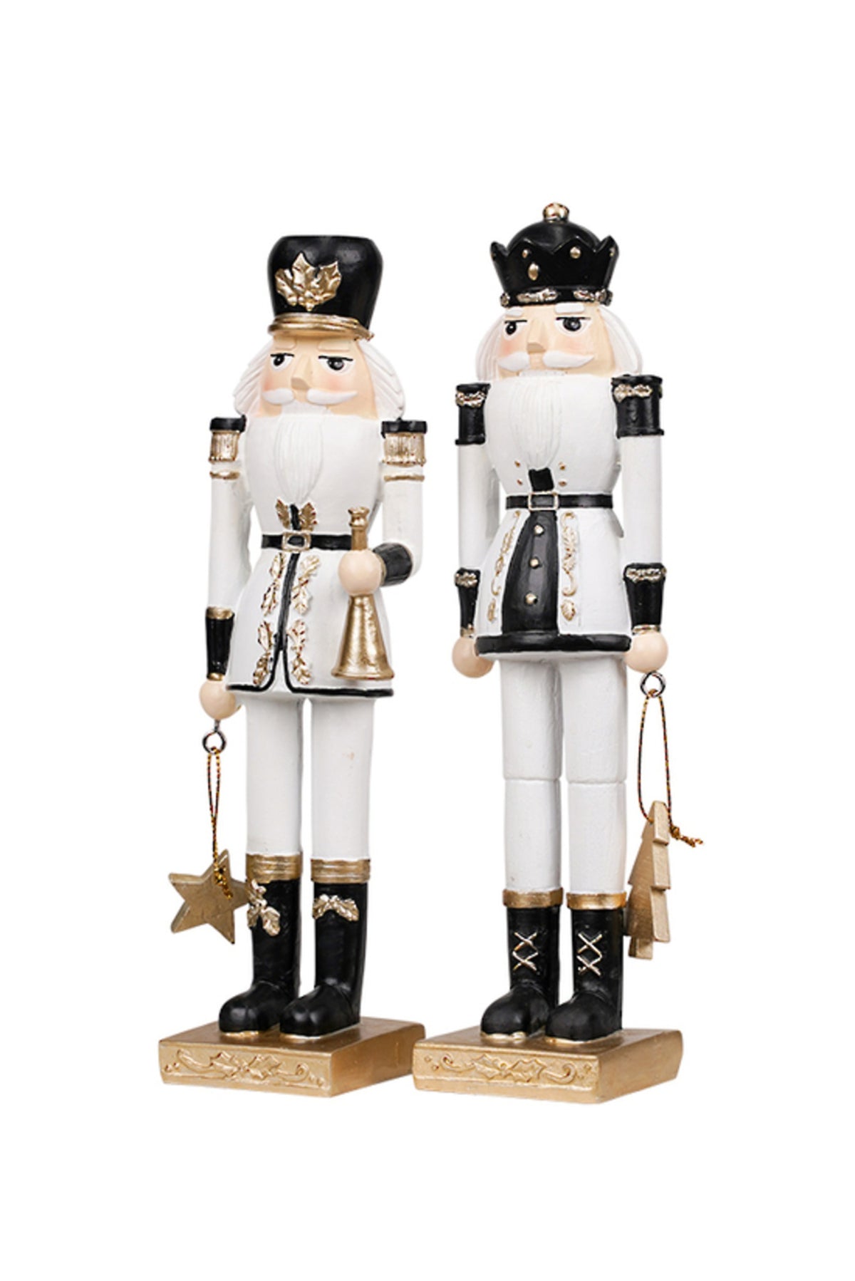 Nutcracker soldiers holding a star and trumpet and holding a tree, shown together