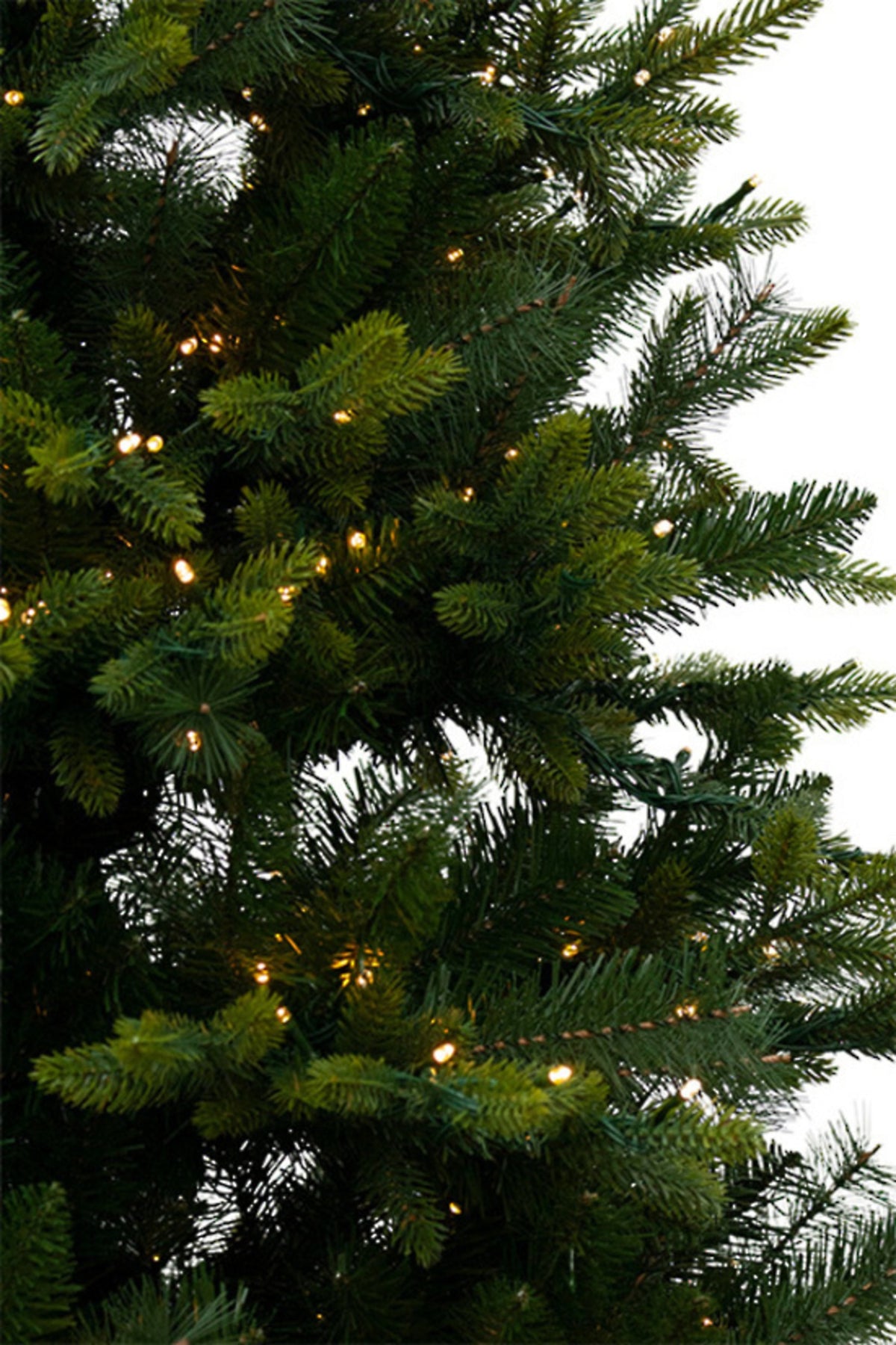 Spruce pre-lit Christmas tree, close view of the branches and lights