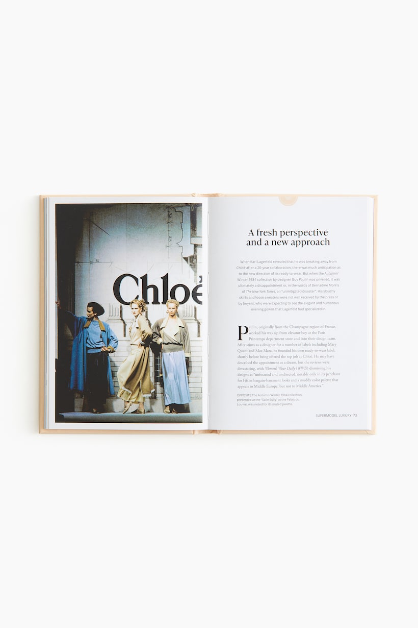 Little Book of Chloé styled with a candle and vase