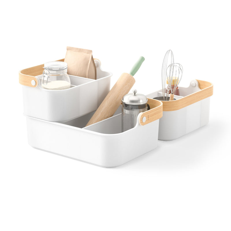 A white kitchen set with sustainable wood utensils, perfect for organizing with the help of Umbra Bellwood Storage Bins.