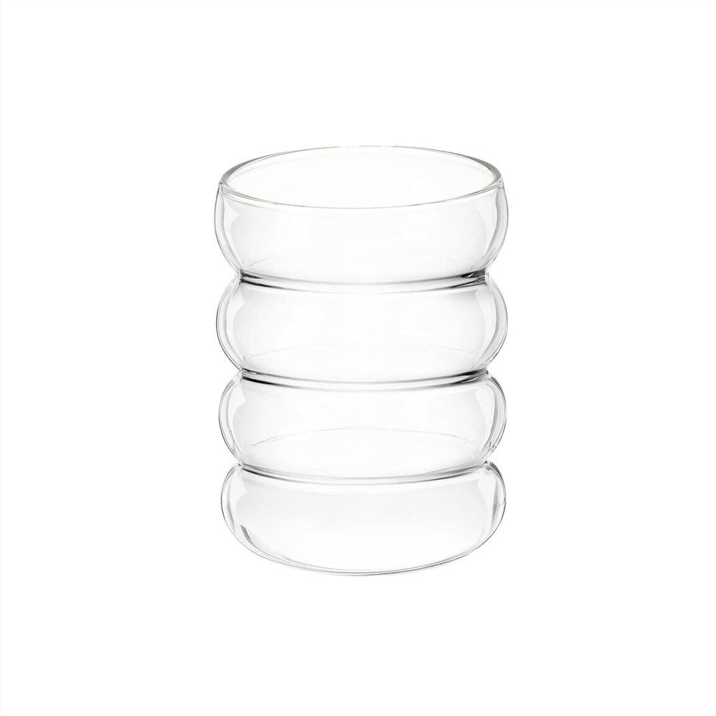 Caterpillar rippled glass tumbler in clear borosilicate glass, 300ml capacity, styled on a pale timber bench