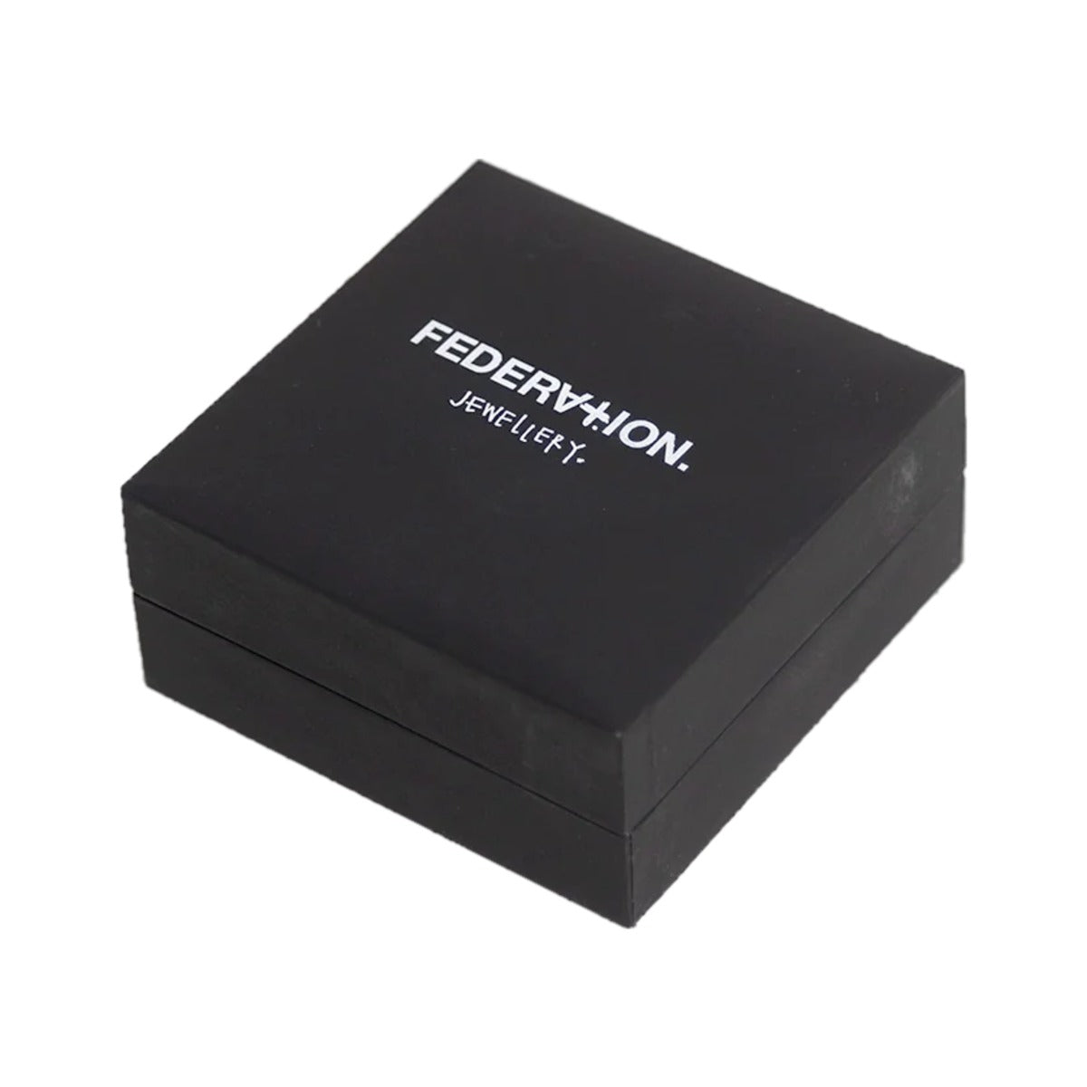 Larger black Federation jewellery box with white logo, lid closed, on pale grey