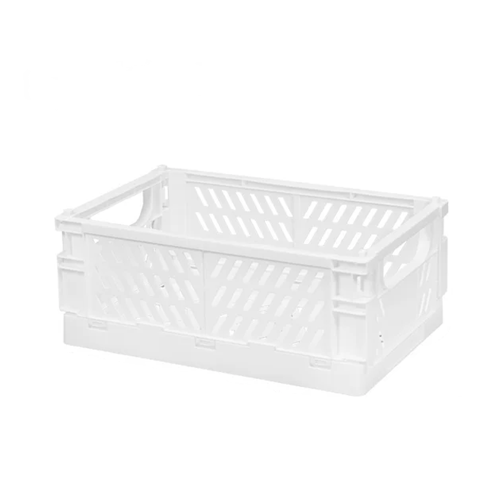 White folding storage crate with slotted sides and cut out handles, on a white background