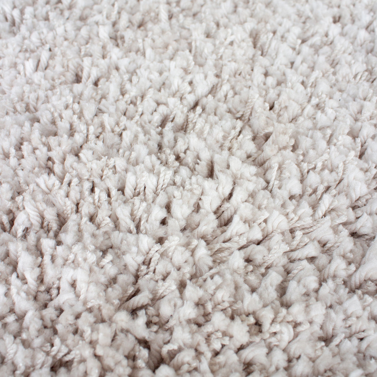 Close view of the deep beige shaggy pile