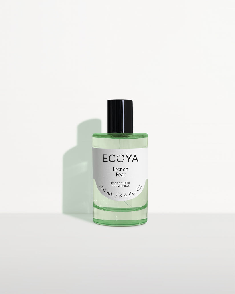 Ecoya room spray in soft green glass with a black cap on white