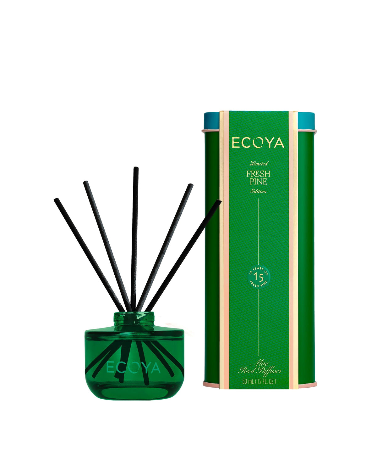 Ecoya Fresh Pine mini reed diffuser 50ml in painted green glass beside its festive tin