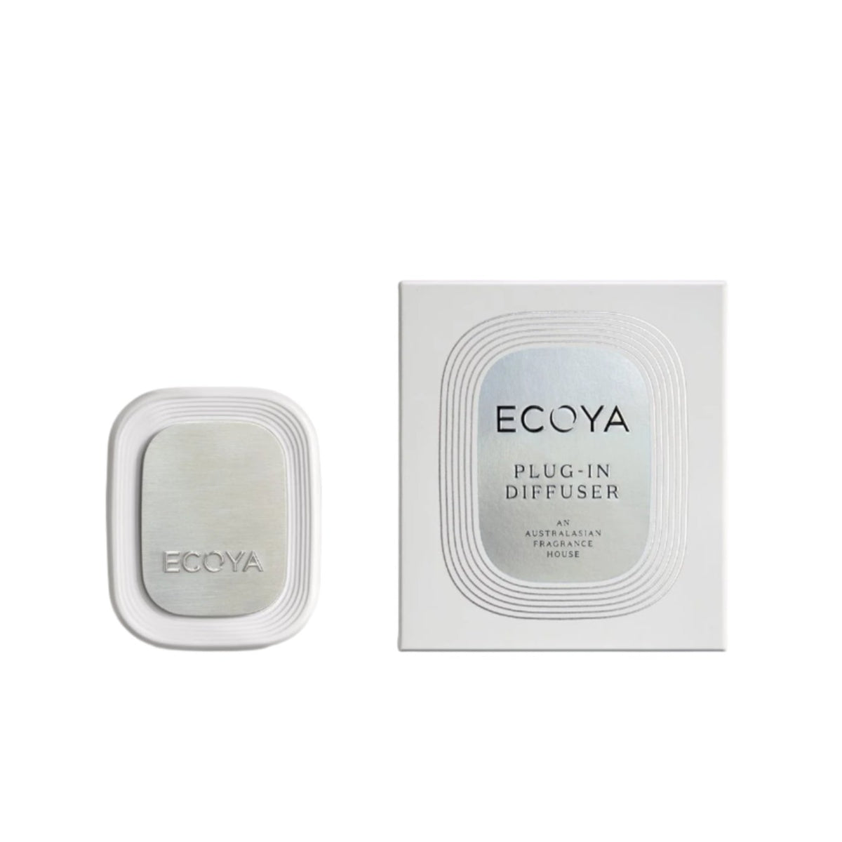 Ecoya Plug-In Diffuser in white with a brushed silver faceplate, shown with its retail packaging