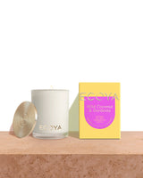 An Ecoya Madison Candle with a box next to it, featuring the Sensory Escapes: Wild Coconut & Gardenia limited edition fragrances for sensory escapes.