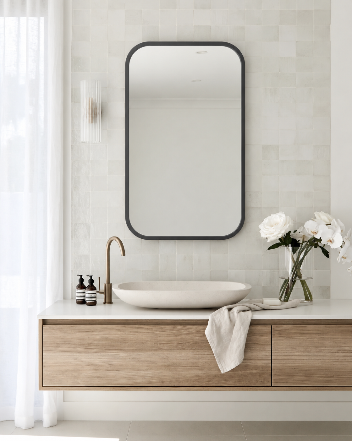 HUB Rectangle Mirror by Umbra on the wall over the vanity