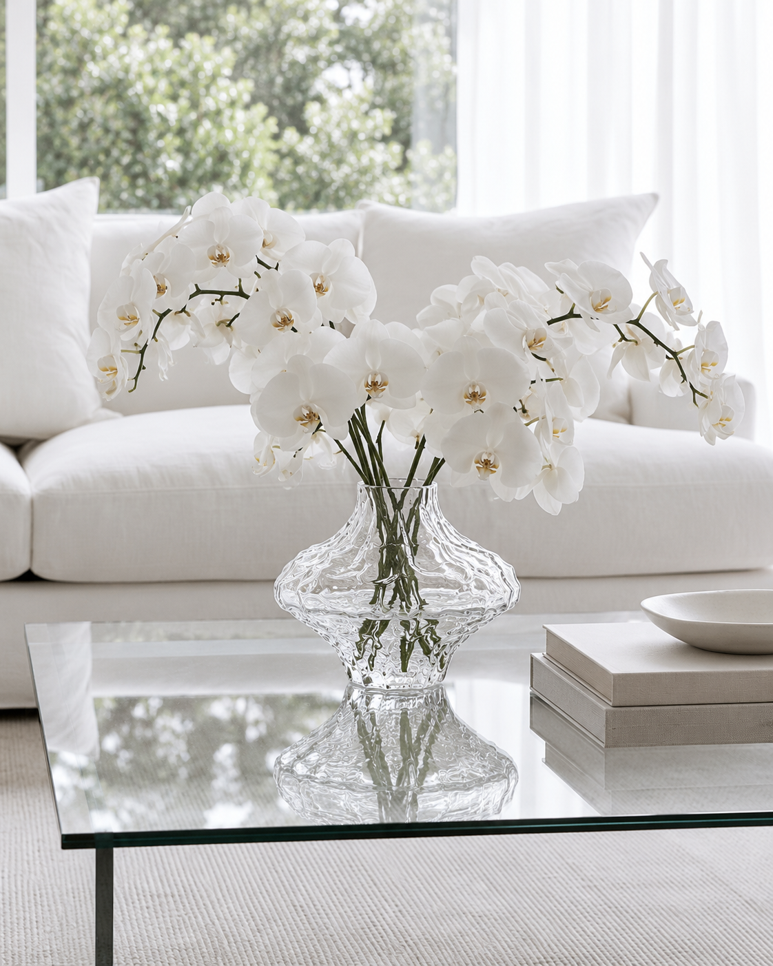 Rippled Crystal Glass Vase in Clear or Black on the glass coffee table holding the white flowers
