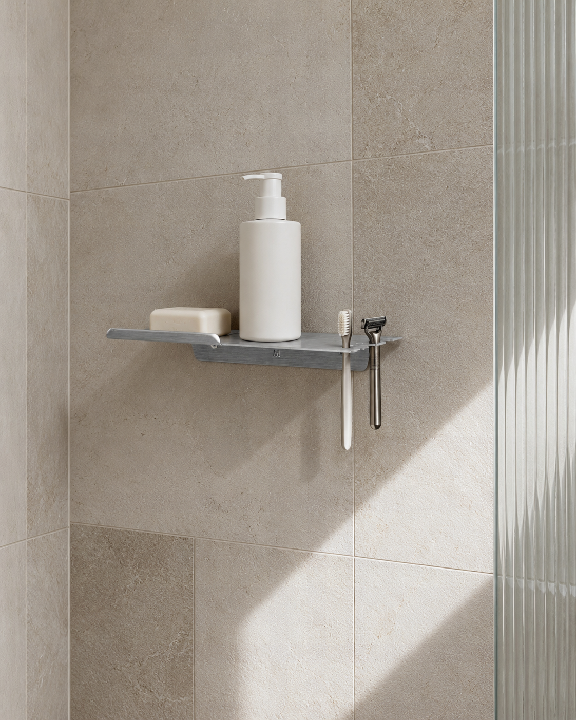 FOLD Shower Shelf, Brushed Aluminium styled on the tiled shower wall