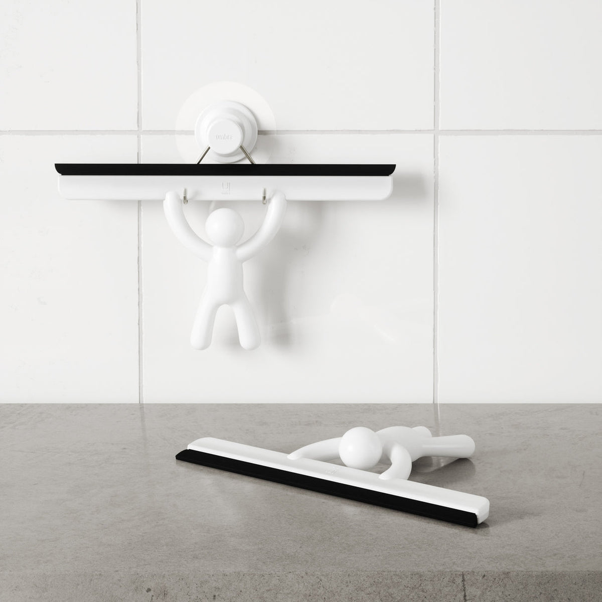 Umbra Buddy Squeegee shown in both black and white colourways for a New Zealand bathroom