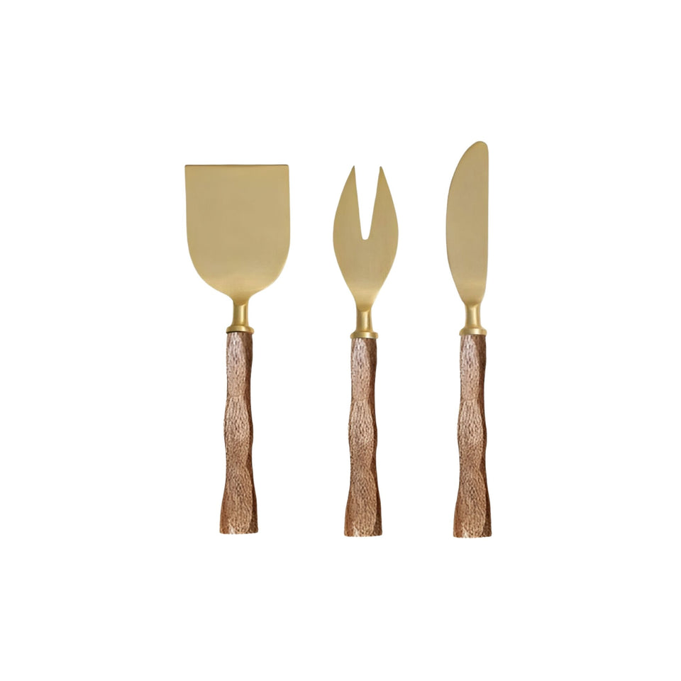 Gold wood cheese knives set of three arranged on a board