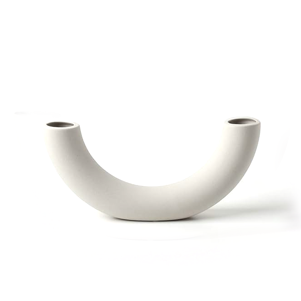 Half pipe ceramic vase in matte white, a U shaped arc with an opening at each raised end