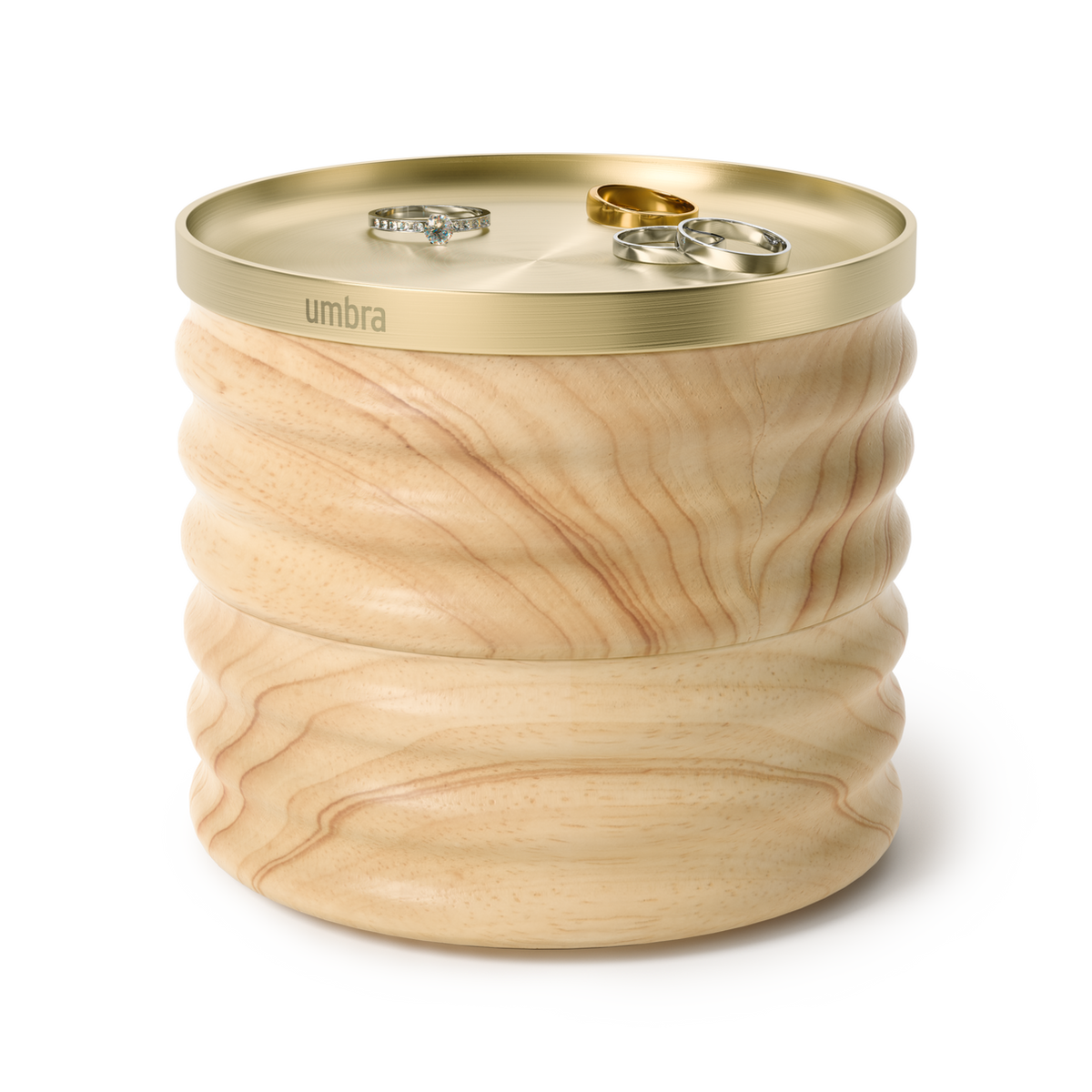 Umbra Tesora storage box in natural ash with rings resting on the brass lid