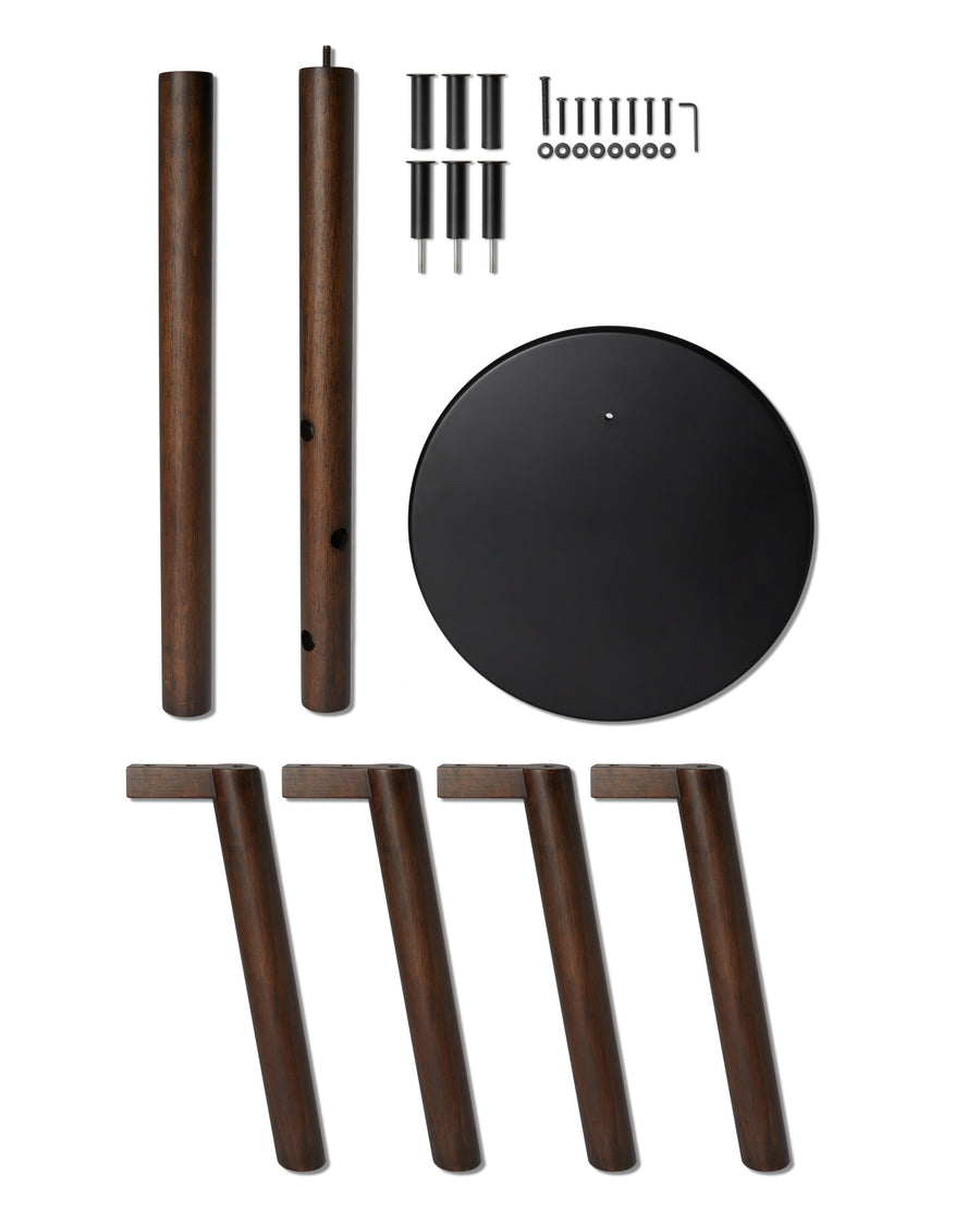 Umbra Pillar coat rack parts laid out, walnut posts, legs, seat and fixings