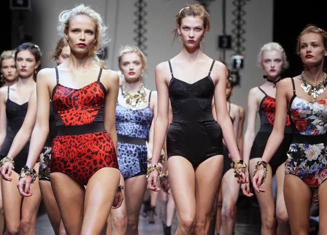 Little Book of Dolce and Gabbana spread showing a runway of leopard print and black corsetry
