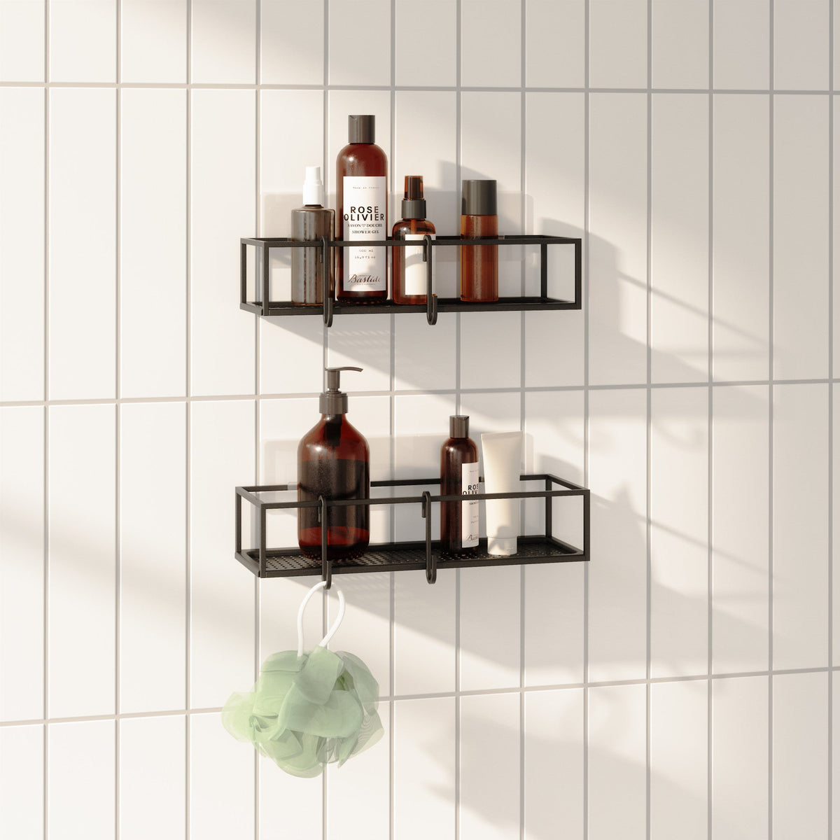 Two Umbra Cubiko wire bins mounted on a bathroom wall holding shower essentials