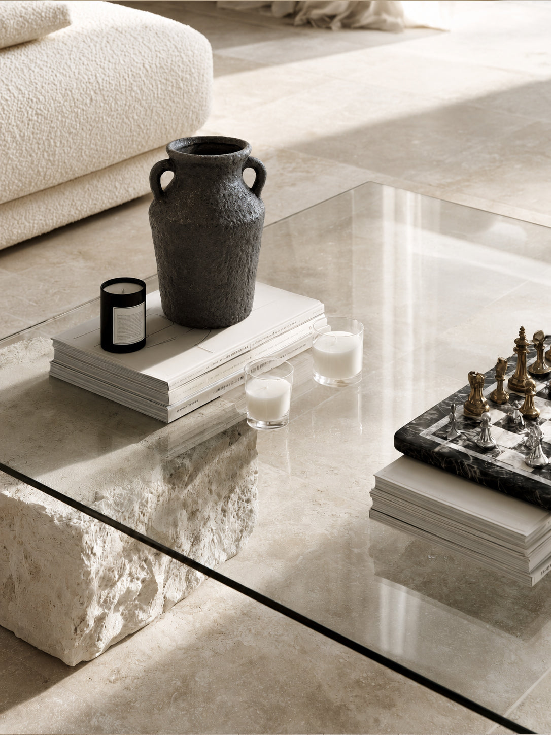 Kaia vase on a glass coffee table with books and a marble dish