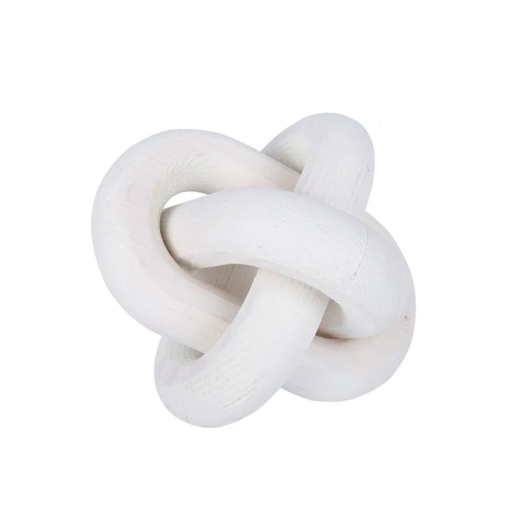 White wooden knot ornament, three carved links interlocked, on a white background