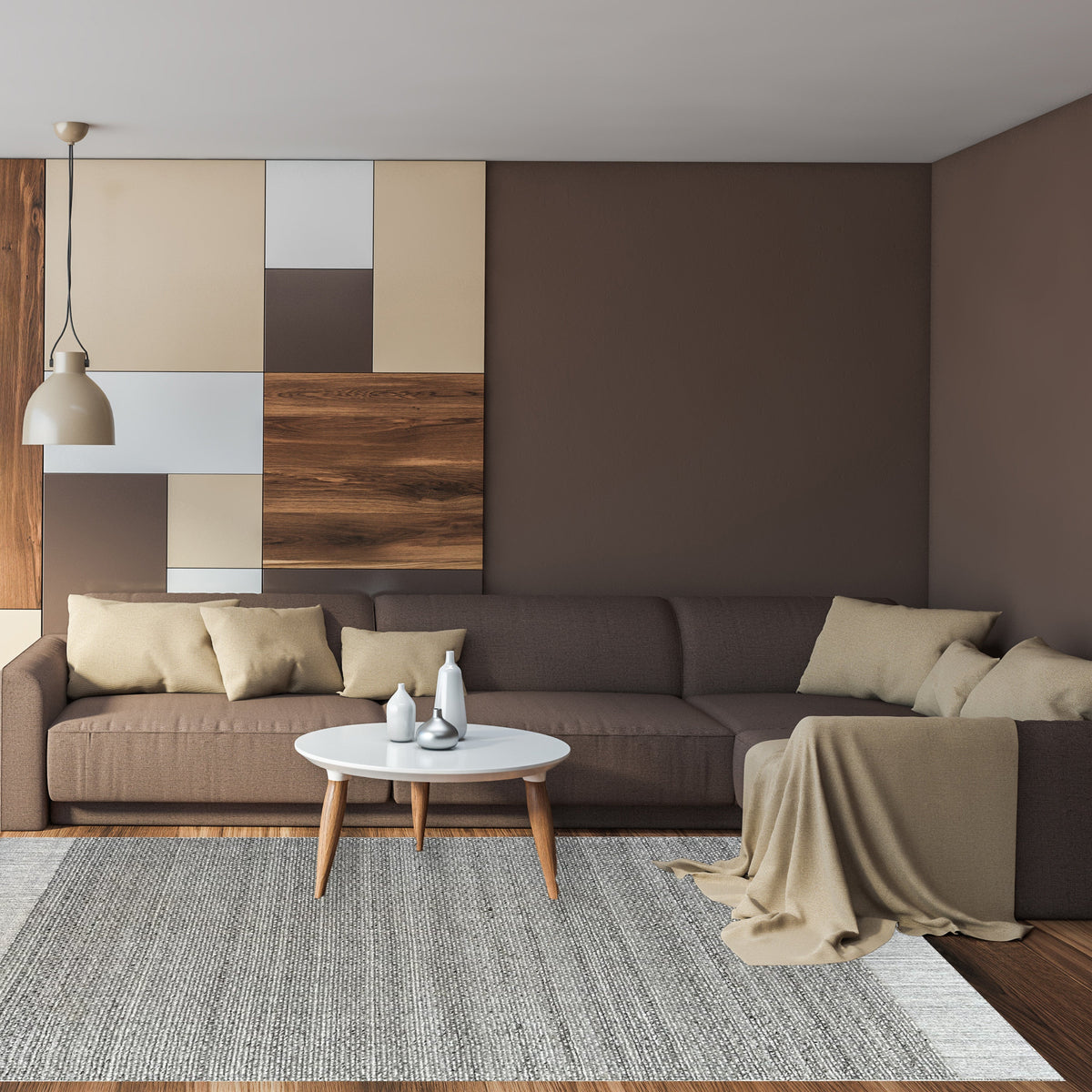 Grey ribbed rug under a round white coffee table in front of a brown sofa and warm panelled wall