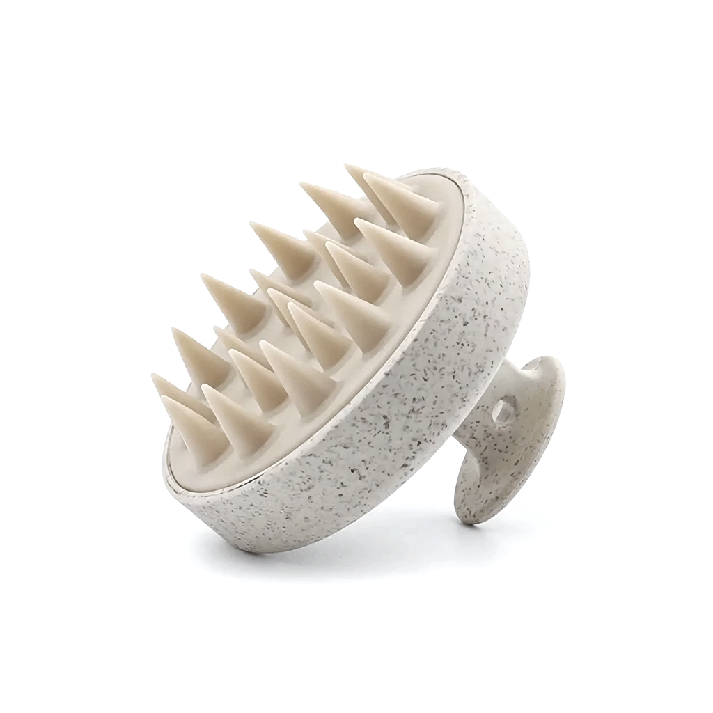Speckled cream scalp massager with soft taupe silicone bristles and a looped back handle