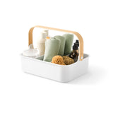 A sustainable Umbra Bellwood Storage Bin for organizing, filled with various items.