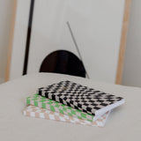 Our THE CHECKLIST NOTEBOOK BLACK lined notebooks in a variety of designs, featuring black and white checkered patterns, are the perfect companion for school, with their cream-colored smooth paper, sewn spine, and Papier HQ.