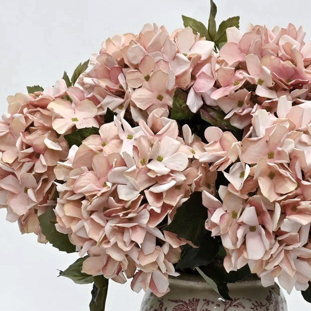 Close-up of rose pink faux country hydrangea heads