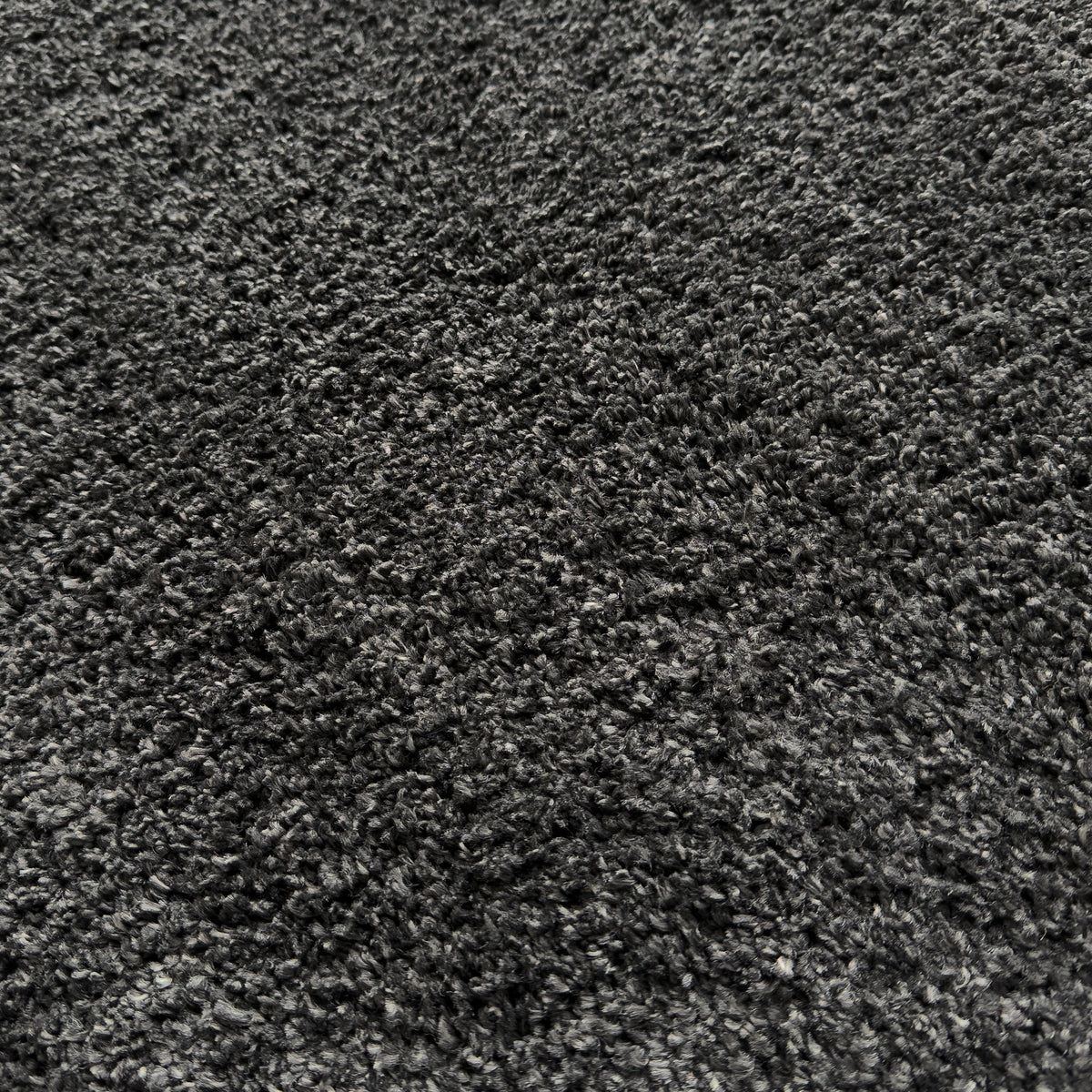 Close view of the dense charcoal plush pile