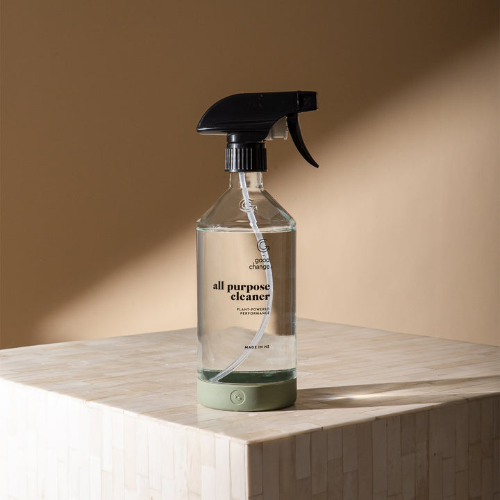 Good Change reusable cleaning spray bottle sitting on a table.