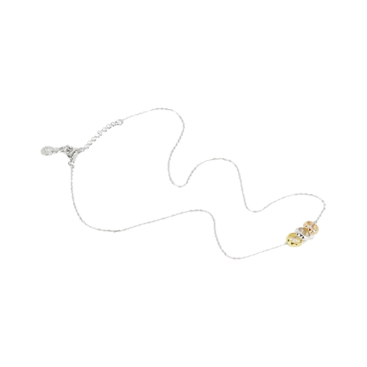 Full length of the Rock Me Necklace laid in a curve on white