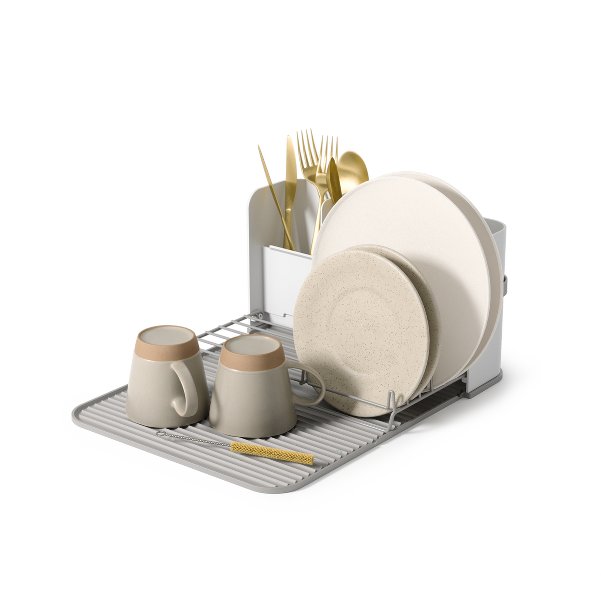 Umbra Sling foldable dish rack in white and grey holding plates, cups and cutlery