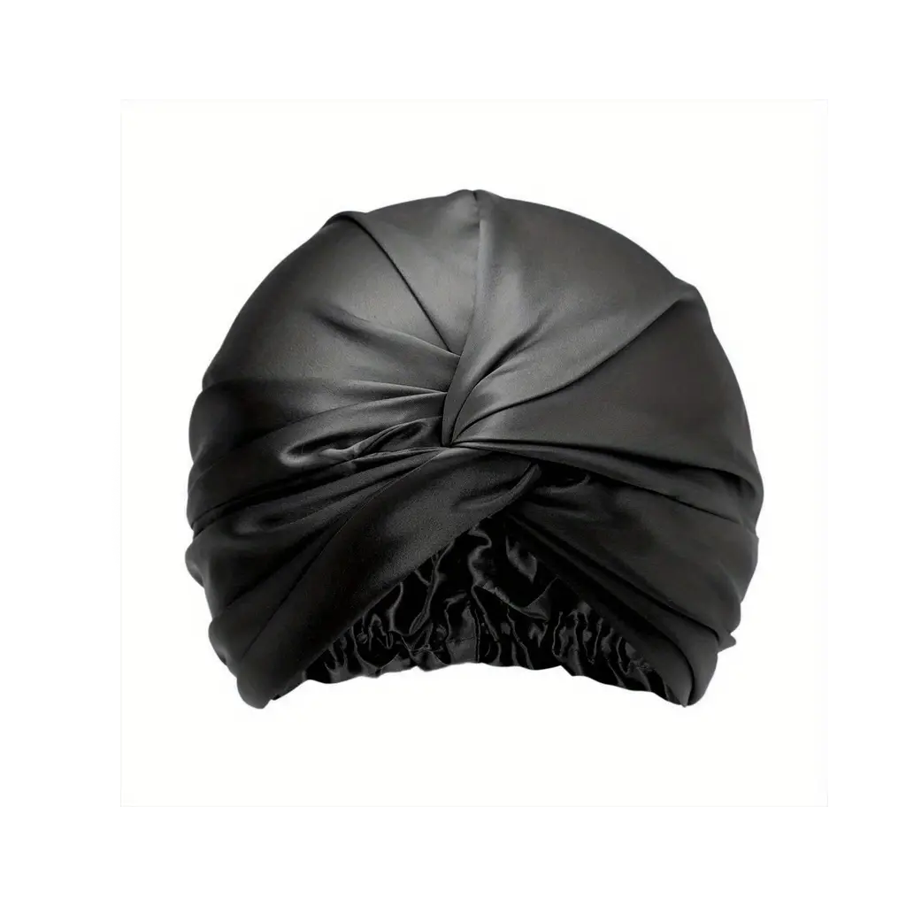 Mulberry silk sleep bonnet in black with a twisted front knot, on a plain background