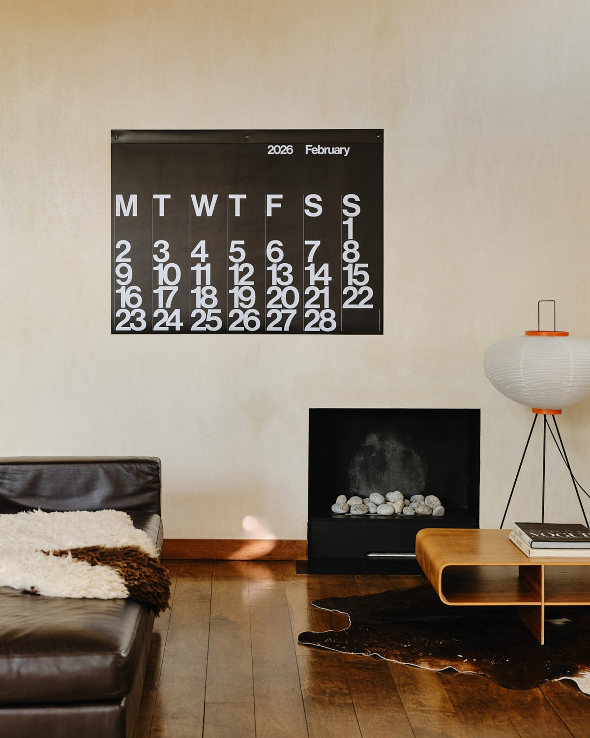 Stendig Calendar by Massimo Vignelli displayed on a neutral living room wall
