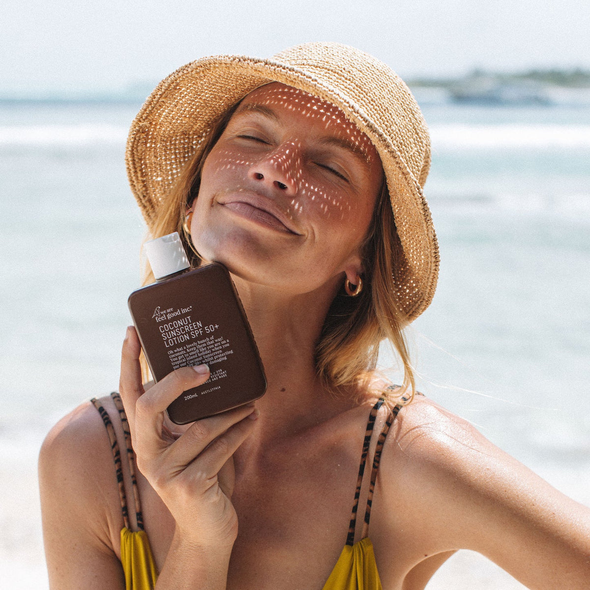 Coconut Sunscreen SPF 50+ by We Are Feel Good Inc. styled outdoors