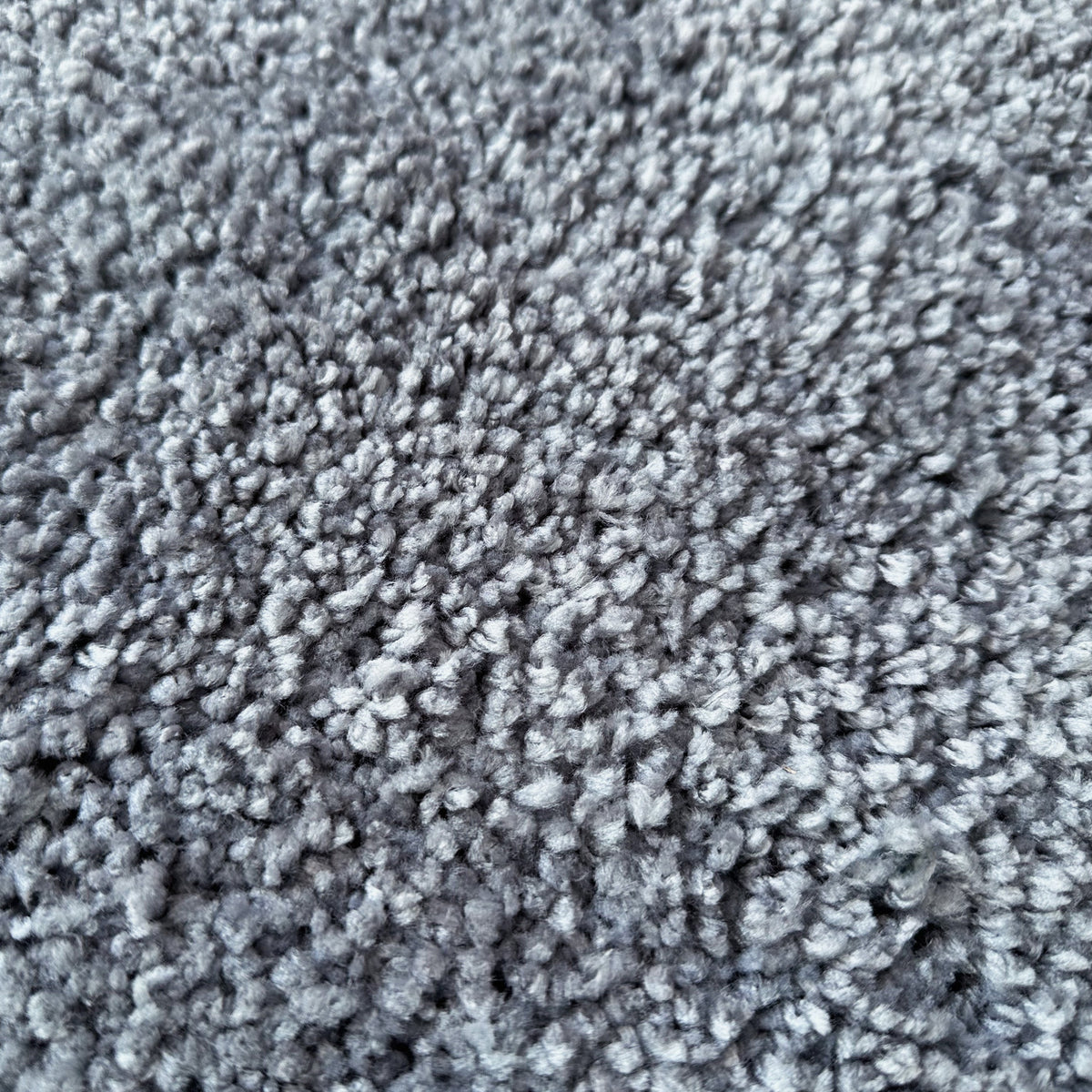 Close view of the ash grey textured shag pile