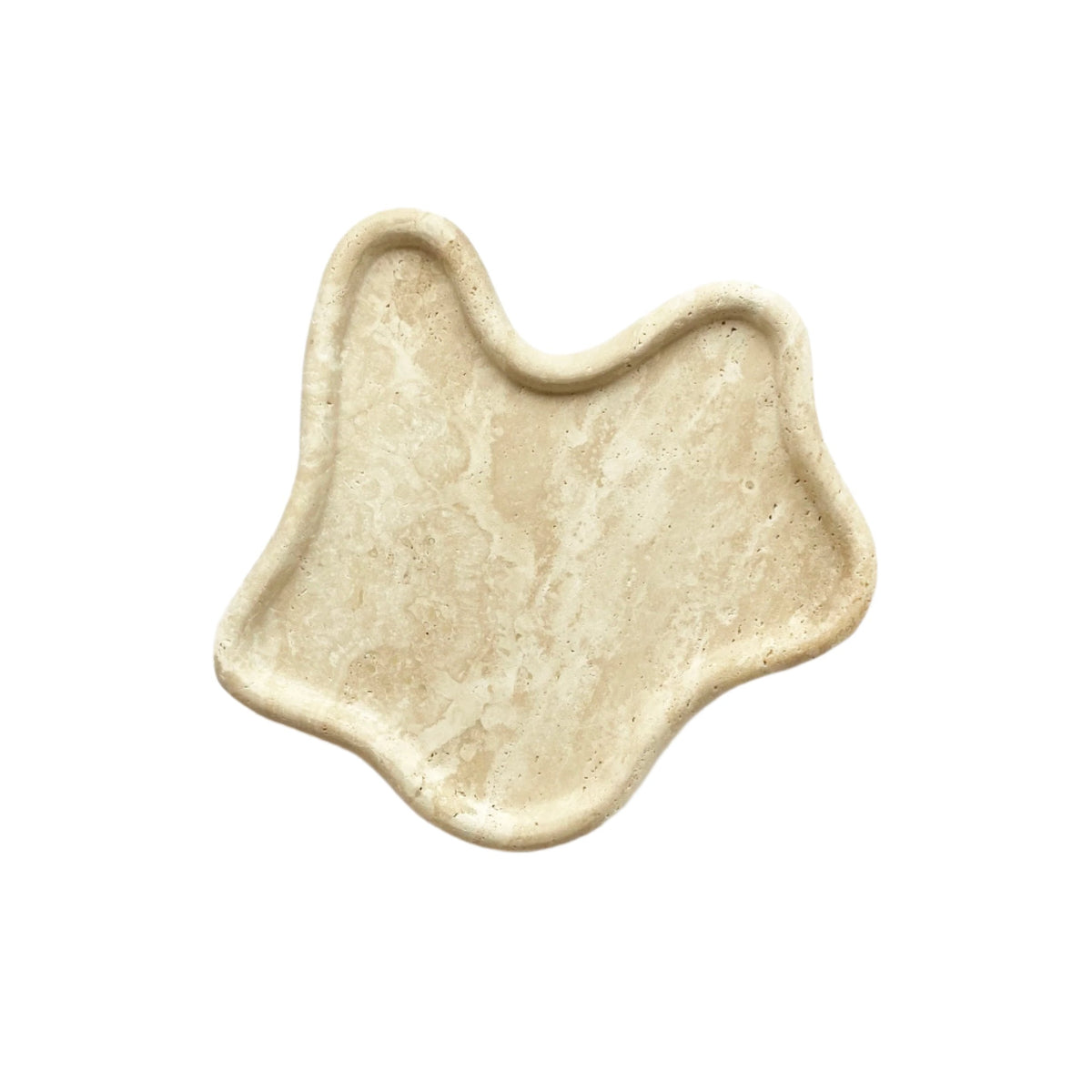 Travertine curved tray in a wavy freeform shape, angled view on white