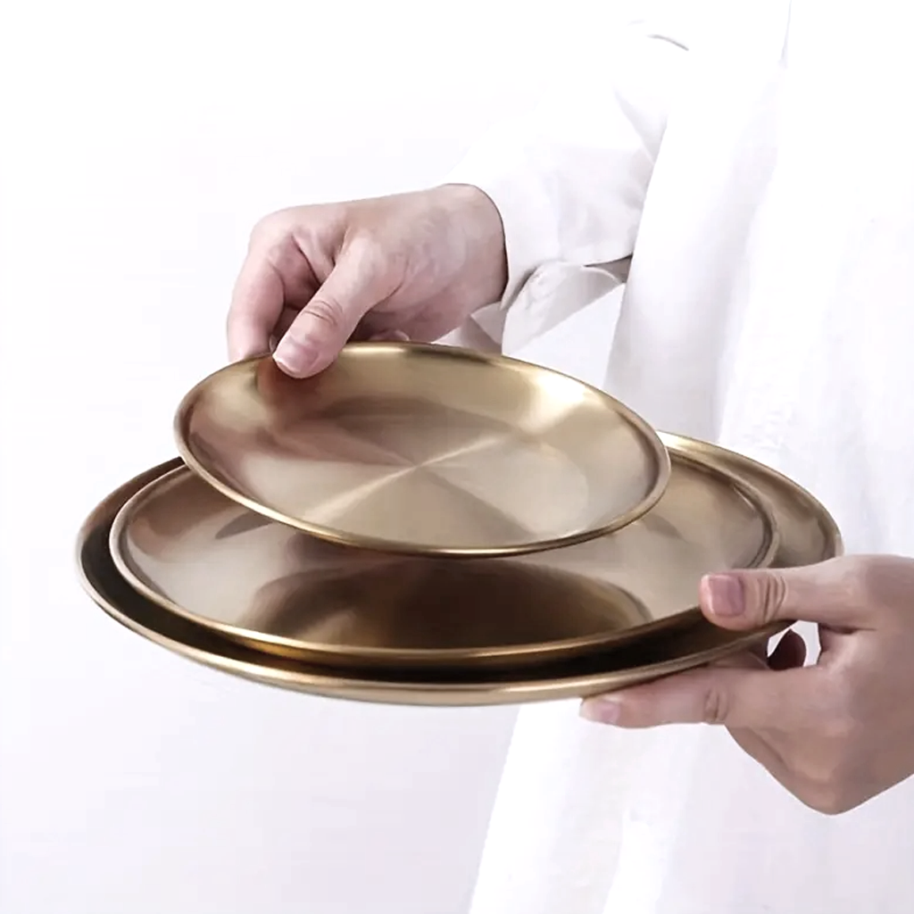 Round stainless steel decor tray in gold finish