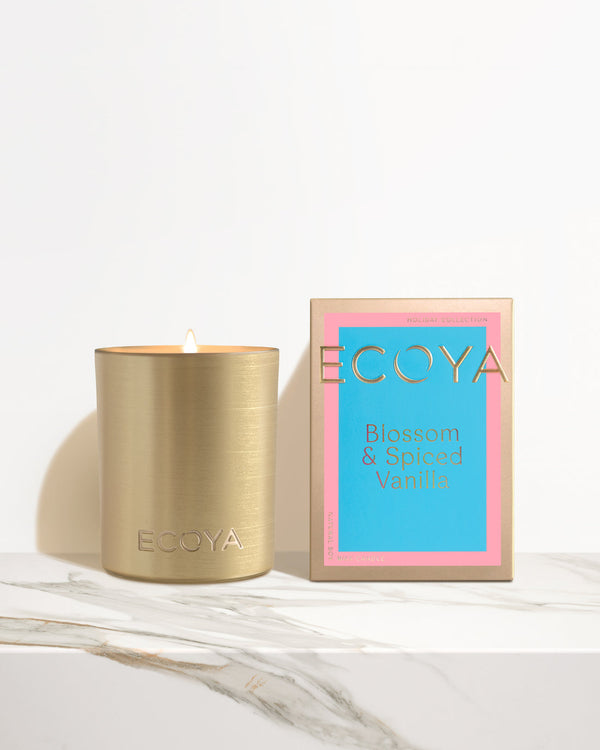 Ecoya Holiday: Blossom & Spiced Vanilla Goldie Candle, from the Holiday Collection, offers a delightful aroma of Spiced Vanilla.
