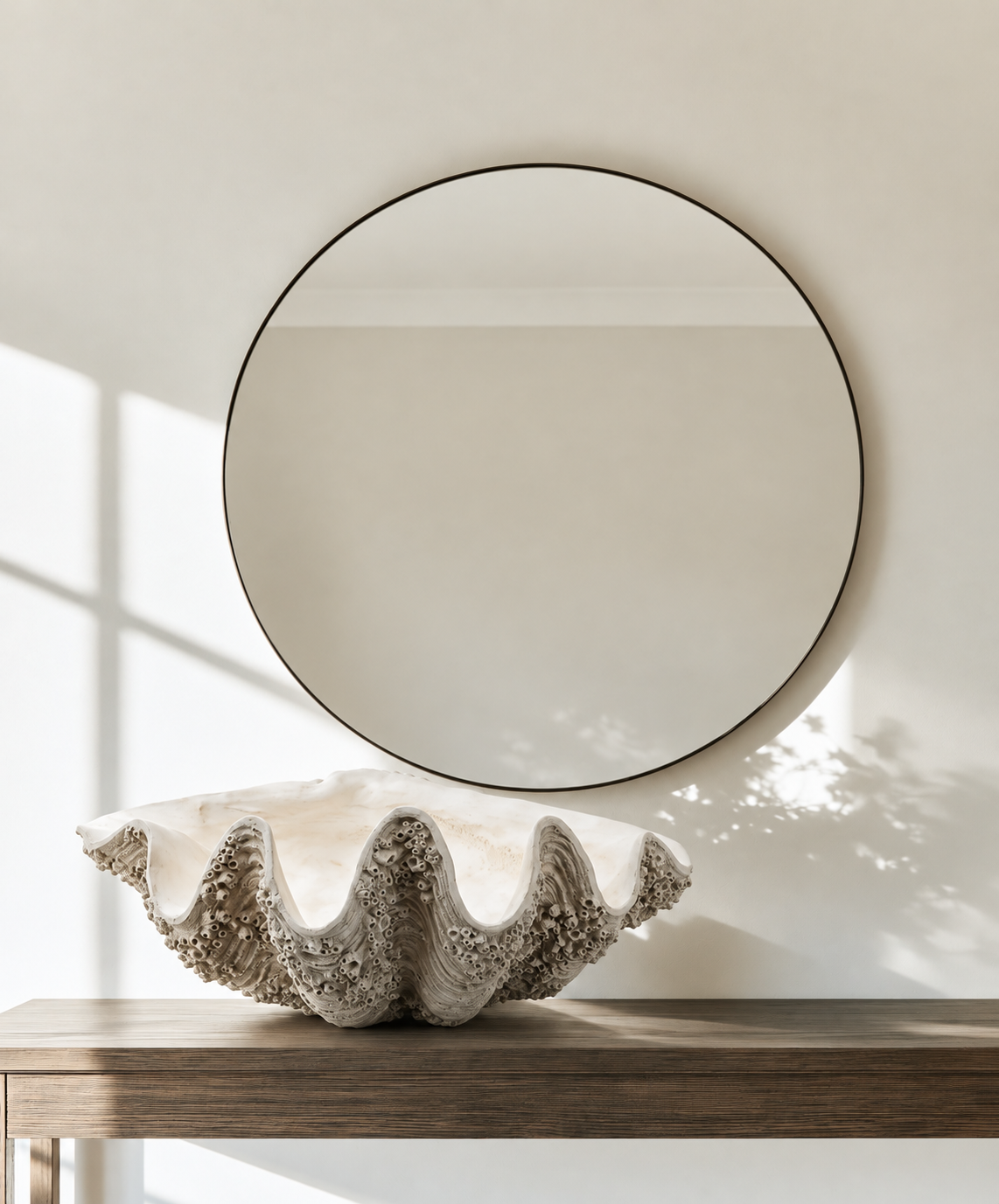 XXL Resin Clam Shell Bowl in natural finish on a timber console beneath a round black mirror
