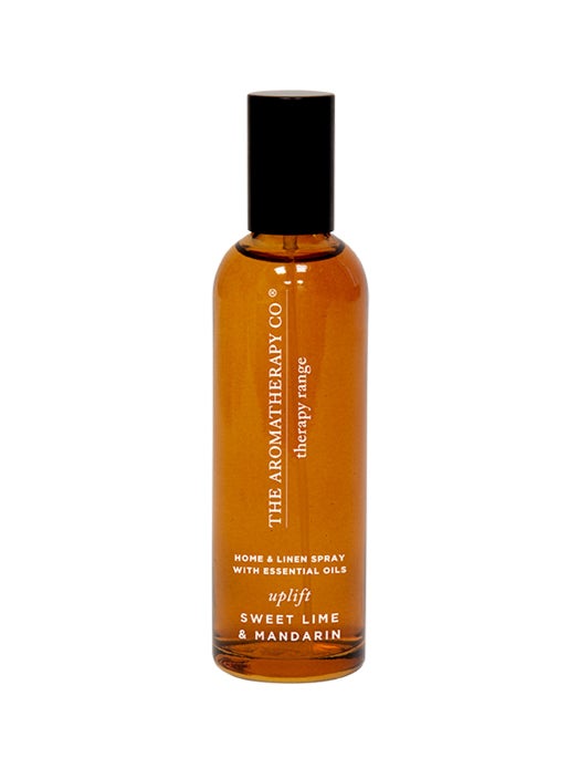 Therapy Sweet Lime & Mandarin room spray in a rounded amber bottle on a white background