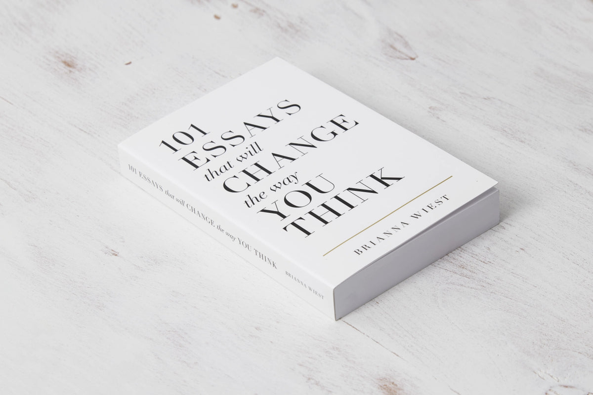 101 Essays That Will Change The Way You Think lying on whitewashed timber