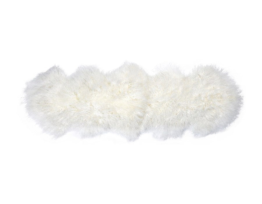 White Tibetan lamb fur double rug with long curly wool on a plain white background