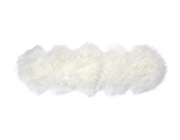 A luxurious Flux Home Tibetan lamb fur double rug on a white surface.